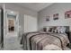 Comfortable bedroom with closet access, featuring gray walls and well-maintained flooring at 4204 Sprints Race Ave, North Las Vegas, NV 89084