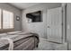 Stylish bedroom with shutters, featuring gray walls and well-maintained floors at 4204 Sprints Race Ave, North Las Vegas, NV 89084