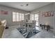Cozy dining room with seating for six and sliding glass doors to the backyard at 4204 Sprints Race Ave, North Las Vegas, NV 89084