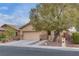Charming single story home with a well-manicured front yard and two car garage in a quiet neighborhood at 4204 Sprints Race Ave, North Las Vegas, NV 89084