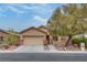 Charming single story home with a well-manicured front yard and two car garage in a quiet neighborhood at 4204 Sprints Race Ave, North Las Vegas, NV 89084