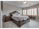 Comfortable main bedroom with ceiling fan and decorative windows at 4204 Sprints Race Ave, North Las Vegas, NV 89084