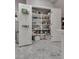 Spacious walk-in pantry features shelving to maximize storage space at 4204 Sprints Race Ave, North Las Vegas, NV 89084