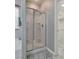 Glass enclosed shower with tile surround at 4204 Sprints Race Ave, North Las Vegas, NV 89084