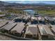 Residential aerial view featuring community of desert homes, green spaces, and water features at 44 Alta Cascata Pl, Henderson, NV 89011