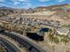 Aerial view of Desert Hot Springs community featuring lush landscaping, water feature and desert landscape at 44 Alta Cascata Pl, Henderson, NV 89011