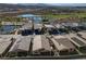 An aerial view showing homes in a community with a nearby golf course and water features at 44 Alta Cascata Pl, Henderson, NV 89011