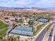 Luxury community featuring tennis courts, pool, and clubhouse with desert mountain views at 44 Alta Cascata Pl, Henderson, NV 89011