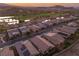 Aerial view of new homes in a scenic community, featuring desert landscaping and water features at 44 Alta Cascata Pl, Henderson, NV 89011