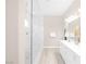 Bright bathroom featuring a glass shower enclosure with white marble-style tile at 44 Alta Cascata Pl, Henderson, NV 89011