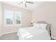 Inviting bedroom offers a cozy atmosphere, shuttered windows, a ceiling fan, and soft natural light at 44 Alta Cascata Pl, Henderson, NV 89011