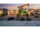 The home's exterior features desert landscaping, a two-car garage, and a well-lit facade at 44 Alta Cascata Pl, Henderson, NV 89011