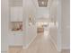 Bright hallway boasts lots of natural light with stylish flooring, and white cabinetry at 44 Alta Cascata Pl, Henderson, NV 89011
