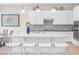 A kitchen featuring white cabinetry, a stainless steel hood, and a large island with seating at 44 Alta Cascata Pl, Henderson, NV 89011