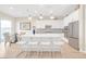 An open kitchen with an island, stainless steel appliances, and access to the backyard at 44 Alta Cascata Pl, Henderson, NV 89011