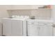 Laundry room with white washer and dryer and bright cabinetry at 44 Alta Cascata Pl, Henderson, NV 89011