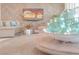 Bright living room features a stylish wooden accent wall, comfortable seating, and modern decor at 44 Alta Cascata Pl, Henderson, NV 89011