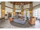 Elegant community lobby with stone pillars, high ceilings, and stylish seating areas at 44 Alta Cascata Pl, Henderson, NV 89011
