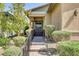 Charming front entrance with landscaped walkway, black iron railing and gate, and covered porch at 480 Heritage Bridge Ave, Henderson, NV 89011