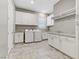 Bright laundry room features granite countertops and plenty of cabinets at 480 Heritage Bridge Ave, Henderson, NV 89011