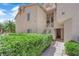 Well-maintained home exterior showing clean landscaping, white staircase and stucco at 5000 Red Rock St # 259, Las Vegas, NV 89118