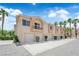 Beautiful multi-Gathering home with attached garages and palm trees against a bright blue sky at 5000 Red Rock St # 259, Las Vegas, NV 89118