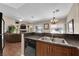 Open kitchen and living room area with stainless steel sink and appliances at 5000 Red Rock St # 259, Las Vegas, NV 89118