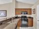 Gourmet kitchen features stainless steel appliances, gas range and granite counters at 5000 Red Rock St # 259, Las Vegas, NV 89118