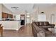 Open floor plan showcasing kitchen and living room with vaulted ceiling at 5000 Red Rock St # 259, Las Vegas, NV 89118