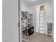 Functional storage room with shelving, fan, ladder, and organized bins, maximizing space efficiency at 5000 Red Rock St # 259, Las Vegas, NV 89118