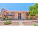 Inviting condo complex with well-maintained landscaping, stone accents, and a red tile roof at 5021 River Glen Dr # 45, Las Vegas, NV 89103
