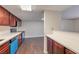 Clean, spacious kitchen layout with wood-look floors and updated stainless steel appliances at 5021 River Glen Dr # 45, Las Vegas, NV 89103