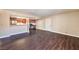 Spacious living area, showcasing the open layout with modern kitchen, sleek countertops and wood-look flooring at 5021 River Glen Dr # 45, Las Vegas, NV 89103