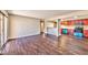 Open-concept living area with wood floors connecting to an eat-in kitchen, perfect for entertaining at 5021 River Glen Dr # 45, Las Vegas, NV 89103