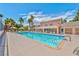 Resort-style pool with blue water, palm trees, sun loungers, and a well-maintained pool deck at 5021 River Glen Dr # 45, Las Vegas, NV 89103