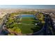 Gorgeous aerial view of the community park and pond surrounded by walking paths in a well-maintained neighborhood at 516 Red Lovebird Ave # Lot 1242, Henderson, NV 89011