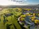 An aerial view of a lush community park, playgrounds, walkways, and ample green space at 516 Red Lovebird Ave # Lot 1242, Henderson, NV 89011