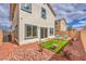 A cute backyard featuring low-maintenance desert landscaping and an outdoor seating area at 516 Red Lovebird Ave # Lot 1242, Henderson, NV 89011