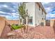 This yard offers rock landscaping and a cozy seating area at 516 Red Lovebird Ave # Lot 1242, Henderson, NV 89011
