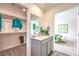 Stylish bathroom featuring walk-in closet, single vanity, modern fixtures, and wood-look floors, connecting to the Primary bedroom at 516 Red Lovebird Ave # Lot 1242, Henderson, NV 89011