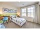 bedroom showcasing dinosaur themed decor, modern desk, and large windows providing ample natural light at 516 Red Lovebird Ave # Lot 1242, Henderson, NV 89011