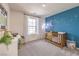 Charming Bedroom features a moon and stars accent wall and a classic wooden crib near a window at 516 Red Lovebird Ave # Lot 1242, Henderson, NV 89011
