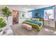 Bright bedroom with blue accent wall, en-suite bathroom, and stylish contemporary furnishings at 516 Red Lovebird Ave # Lot 1242, Henderson, NV 89011