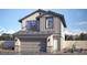 Charming two-story home with a neutral color palette, gray trim, a two-car garage, and desert landscaping at 516 Red Lovebird Ave # Lot 1242, Henderson, NV 89011