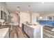 Spacious kitchen with a large island, stainless steel appliances, and a view into the adjacent living area at 516 Red Lovebird Ave # Lot 1242, Henderson, NV 89011