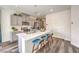 Modern kitchen with gray cabinets, stainless steel appliances, a large island, and bar stool seating at 516 Red Lovebird Ave # Lot 1242, Henderson, NV 89011