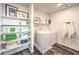Functional laundry room features shelving, a modern washer/dryer, and stylish decor at 516 Red Lovebird Ave # Lot 1242, Henderson, NV 89011