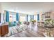 Bright, open living room and kitchen with modern furnishings and lots of natural light from large windows at 516 Red Lovebird Ave # Lot 1242, Henderson, NV 89011