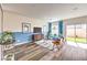 Cozy living room with stylish furniture, a modern media console, and sliding doors to a backyard at 516 Red Lovebird Ave # Lot 1242, Henderson, NV 89011