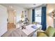 Bright office space features a white desk, guitars, and a view to the outside at 516 Red Lovebird Ave # Lot 1242, Henderson, NV 89011